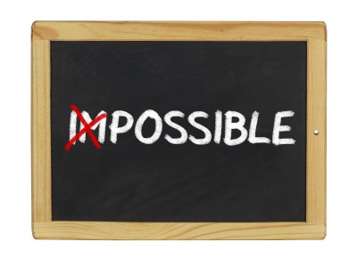 chalk board with word impossible on it