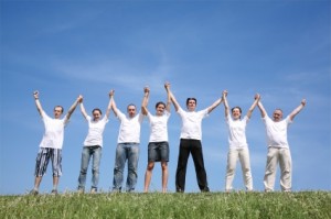 Seven friends in white shirts have waved hands